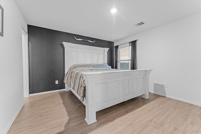 126 Spring Rose Dr, Magnolia, TX 77354 - bedroom featuring light wood-style flooring and baseboards