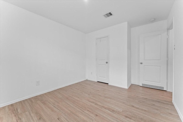 126 Spring Rose Dr, Magnolia, TX 77354 - unfurnished bedroom with light wood-style flooring and baseboards