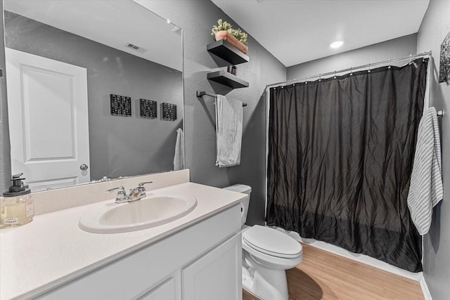 126 Spring Rose Dr, Magnolia, TX 77354 - bathroom featuring vanity, toilet, a shower with shower curtain, wood finished floors, and a textured wall