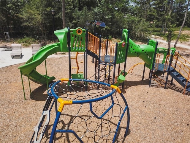 126 Spring Rose Dr, Magnolia, TX 77354 - community jungle gym with view of wooded area
