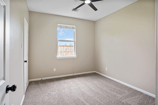 spare room featuring baseboards, ceiling fan, carpet, and visible vents
