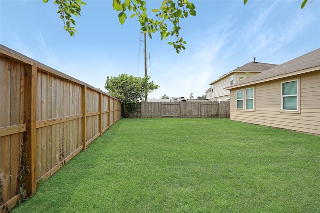 view of yard featuring a fenced backyard