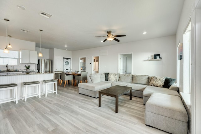living area featuring visible vents, ceiling fan, recessed lighting, and light wood finished floors