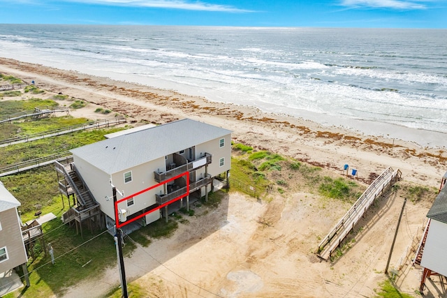 bird's eye view featuring a beach view and a water view