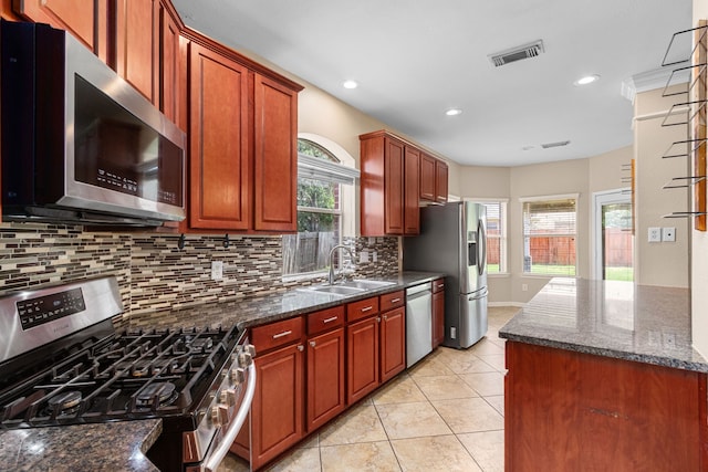 kitchen with recessed lighting, a sink, visible vents, backsplash, and appliances with stainless steel finishes