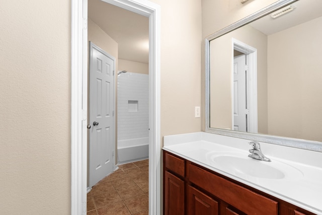 bathroom featuring tile patterned flooring, visible vents, and vanity