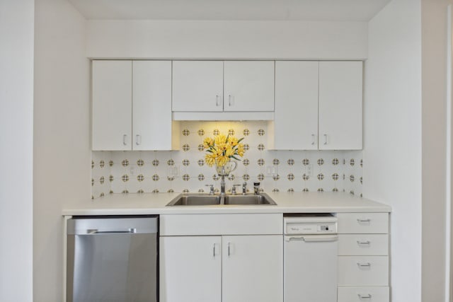 101 Westcott St Unit 1402, Houston, TX 77007 - kitchen with dishwasher, a sink, light countertops, and white cabinets