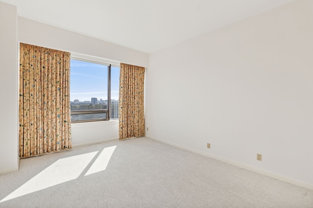 101 Westcott St Unit 1402, Houston, TX 77007 - carpeted spare room with baseboards and a city view