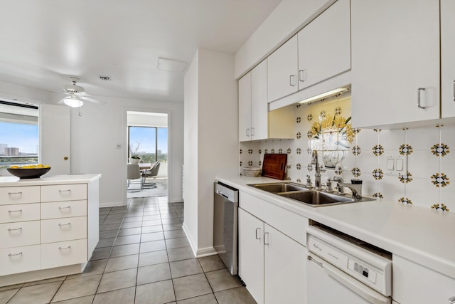 101 Westcott St Unit 1402, Houston, TX 77007 - kitchen with dishwasher, light countertops, a sink, and white cabinets