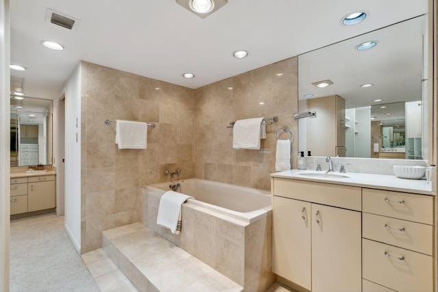 101 Westcott St Unit 1402, Houston, TX 77007 - full bathroom featuring a bath, vanity, recessed lighting, and tile patterned flooring