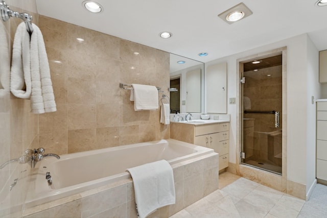 101 Westcott St Unit 1402, Houston, TX 77007 - bathroom with a shower stall, a garden tub, vanity, tile patterned floors, and recessed lighting