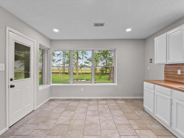 307 Binnacle Way, Crosby, TX 77532 - interior space with baseboards, stone finish floor, recessed lighting, and visible vents
