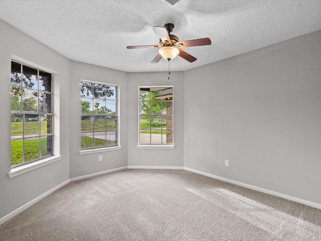 307 Binnacle Way, Crosby, TX 77532 - empty room featuring carpet floors, baseboards, a ceiling fan, and a textured ceiling