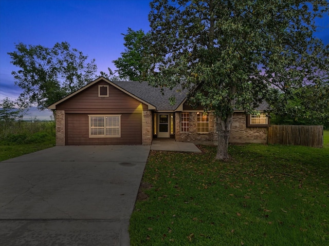 307 Binnacle Way, Crosby, TX 77532 - view of front facade with fence, a yard, driveway, and brick siding