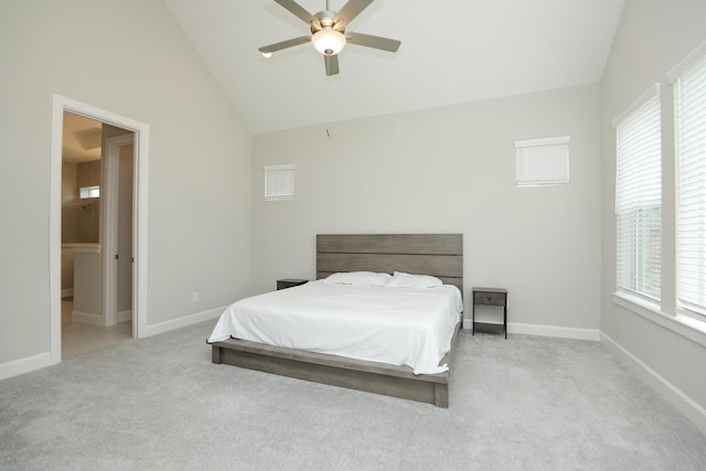 carpeted bedroom featuring a ceiling fan, multiple windows, lofted ceiling, and baseboards