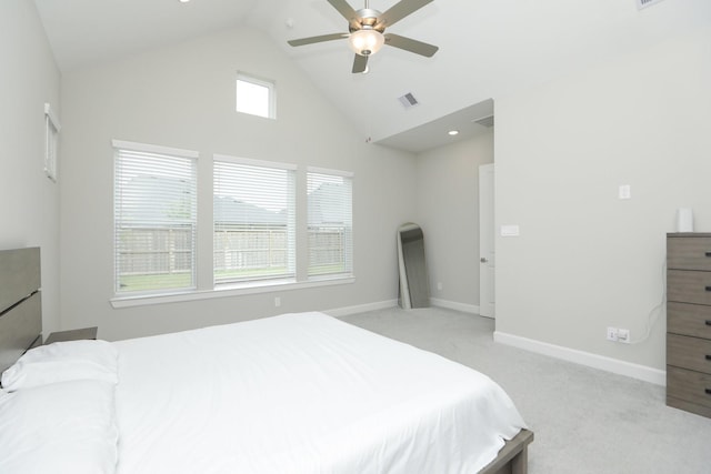 bedroom featuring light colored carpet, ceiling fan, baseboards, visible vents, and high vaulted ceiling