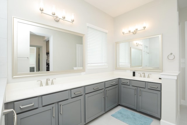 bathroom featuring double vanity and a sink