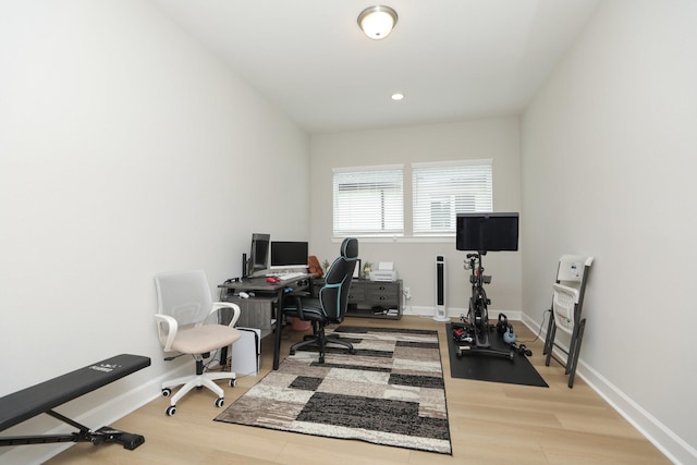 office space with baseboards, recessed lighting, and wood finished floors