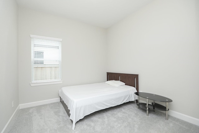 carpeted bedroom with baseboards
