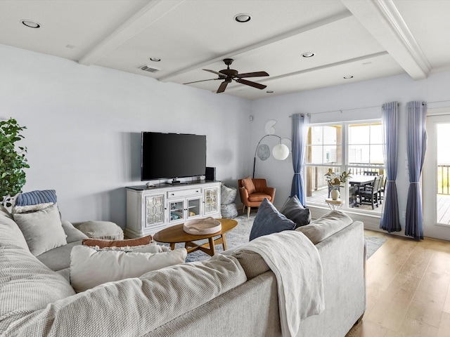 4138 Defender Ln, Galveston, TX 77554 - living room with beam ceiling, visible vents, light wood-style flooring, and plenty of natural light