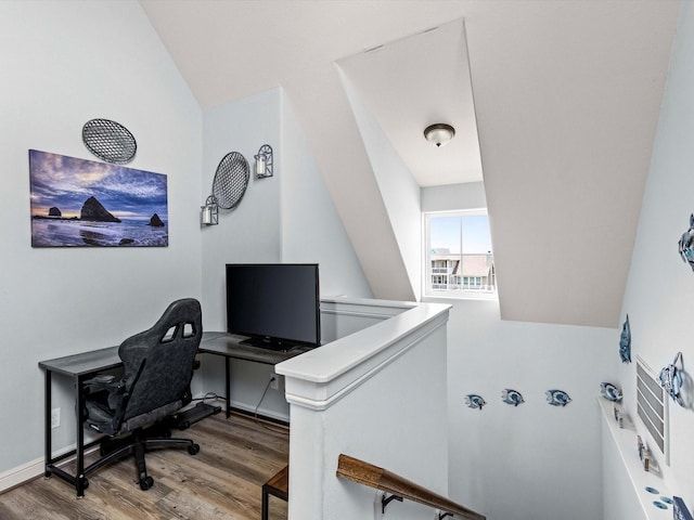 4138 Defender Ln, Galveston, TX 77554 - office area featuring wood finished floors and vaulted ceiling
