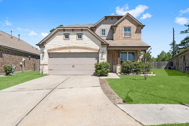 view of front of house featuring brick siding, fence, a shingled roof, driveway, and a front yard