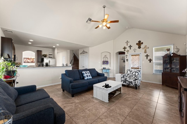 living area featuring stairway, high vaulted ceiling, a ceiling fan, visible vents, and arched walkways