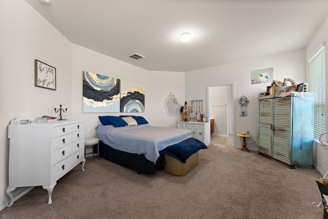 carpeted bedroom with visible vents