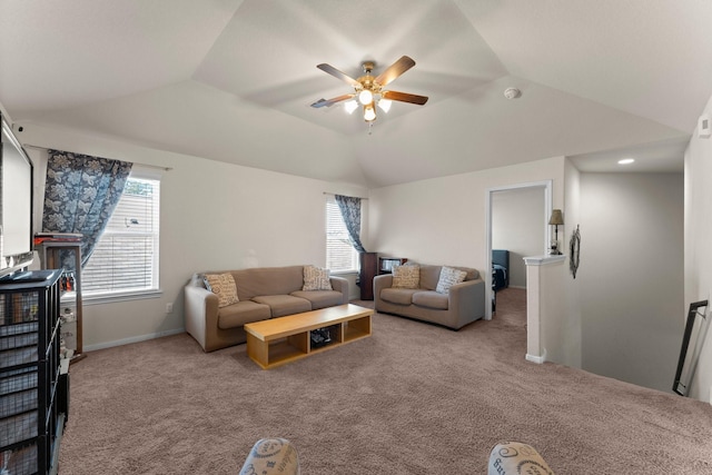 carpeted living room with lofted ceiling and ceiling fan