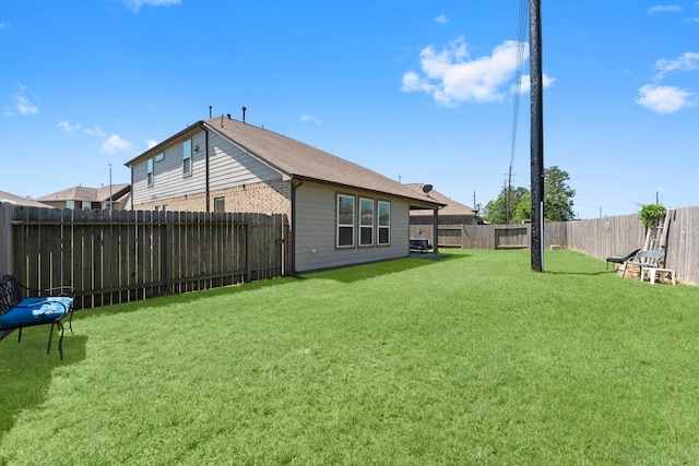 view of yard featuring a fenced backyard