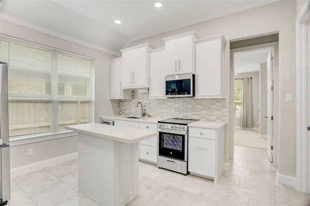 2827 Brisk Autumn Dr, Richmond, TX 77406 - kitchen featuring a sink, decorative backsplash, appliances with stainless steel finishes, and light countertops