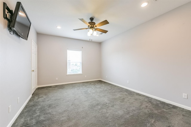 carpeted spare room featuring a ceiling fan, recessed lighting, and baseboards