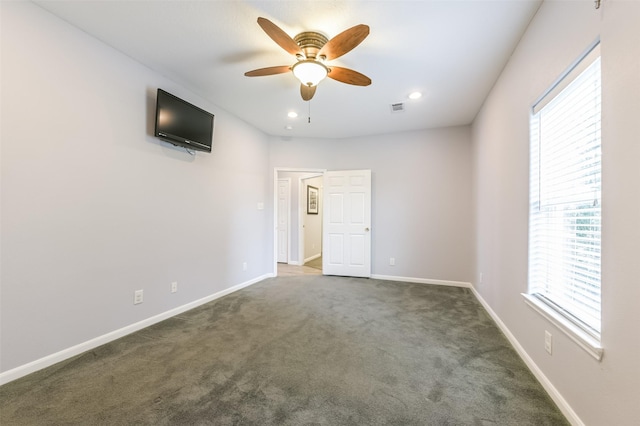 carpeted spare room with recessed lighting, ceiling fan, baseboards, and visible vents