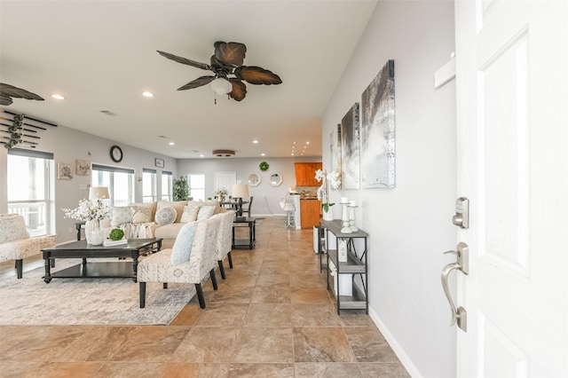 living room featuring visible vents, a ceiling fan, recessed lighting, and baseboards