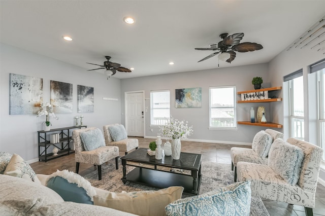 living room featuring ceiling fan, recessed lighting, and baseboards