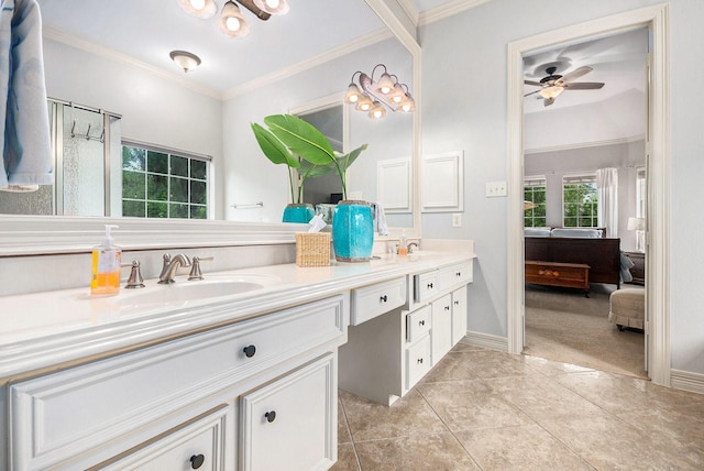 bathroom with a sink, crown molding, double vanity, and ceiling fan