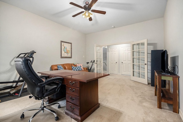 office area with a ceiling fan, french doors, and light colored carpet