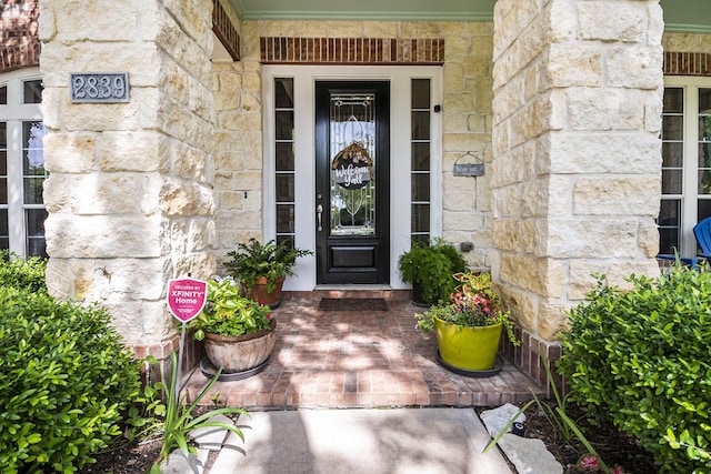 entrance to property with stone siding