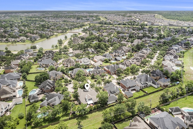 bird's eye view with a water view and a residential view