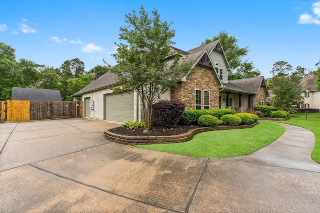 5006 Newport Ct, Spring, TX 77386 - view of front facade with fence, a front lawn, stone siding, a garage, and concrete driveway