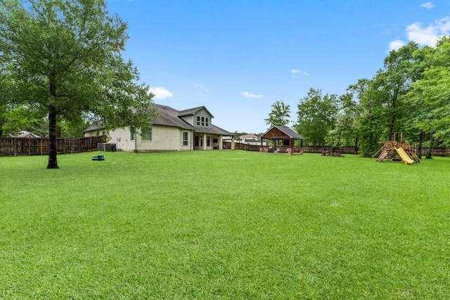 5006 Newport Ct, Spring, TX 77386 - view of yard featuring a gazebo, a fenced backyard, and a playground