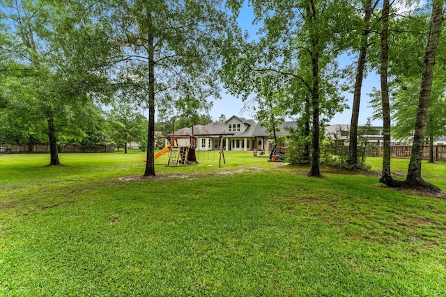 5006 Newport Ct, Spring, TX 77386 - view of yard with a playground and fence