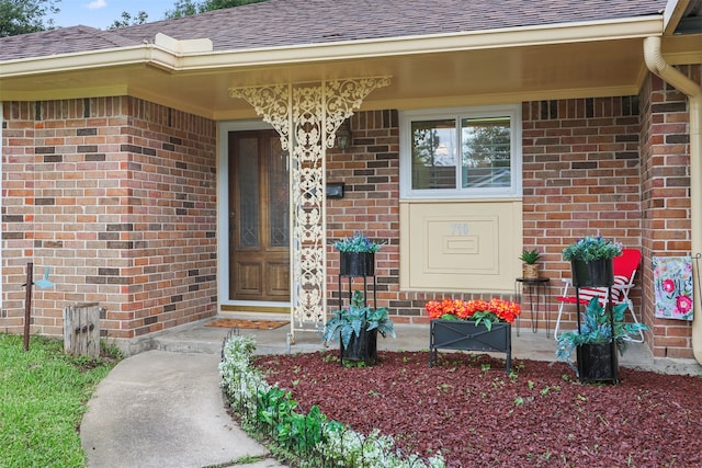 710 Alyse St, Deer Park, TX 77536 - entrance to property with a shingled roof, covered porch, and brick siding