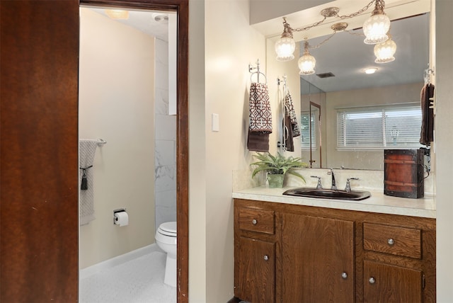 710 Alyse St, Deer Park, TX 77536 - bathroom with visible vents, toilet, vanity, and baseboards