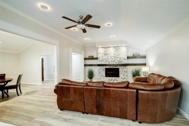 living area with light wood-type flooring, a ceiling fan, baseboards, ornamental molding, and lofted ceiling