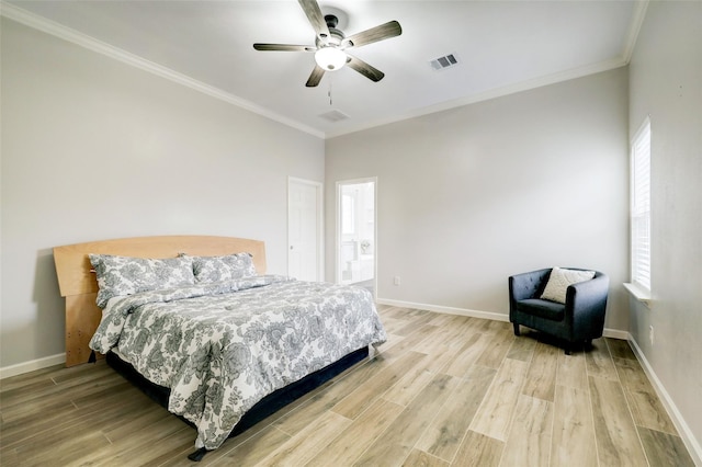 bedroom with ornamental molding, multiple windows, and light wood-style flooring