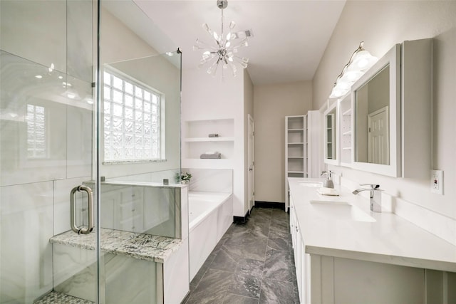 bathroom with a chandelier, a bath, marble finish floor, and a sink