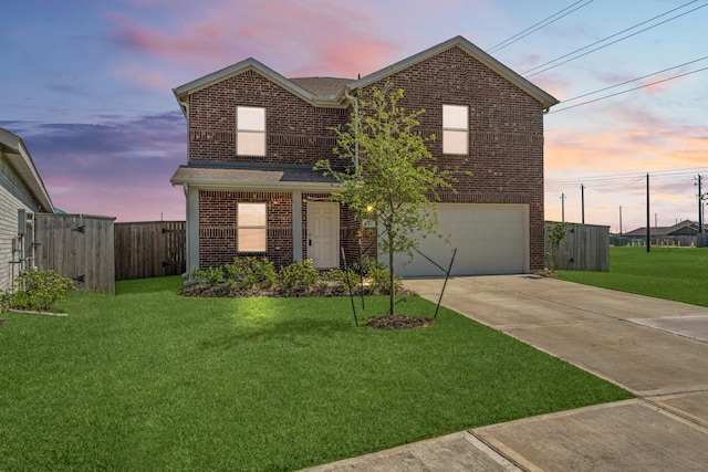 traditional-style house with driveway, an attached garage, fence, brick siding, and a front lawn