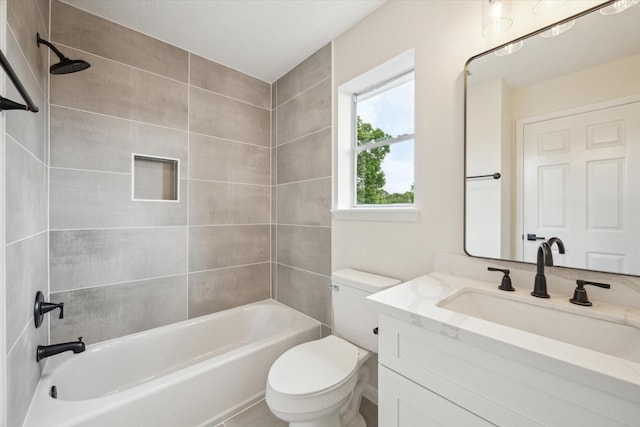 bathroom with shower / bathtub combination, toilet, and vanity
