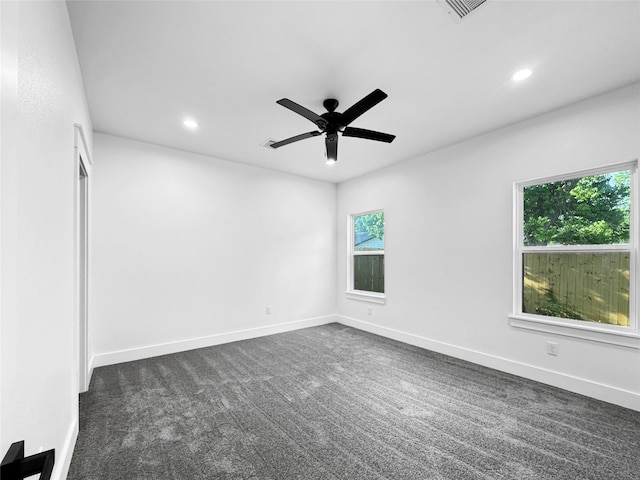 spare room featuring ceiling fan, plenty of natural light, recessed lighting, and visible vents